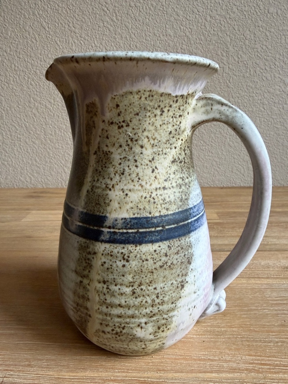 Handcrafted Speckled Ceramic Pitcher in Beige with Blue Stripe - Picture 5 of 13
